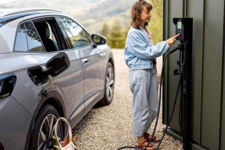 woman charging her electric vehicle at home Hawaii Kai, HI